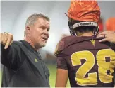 ??  ?? ASU’s special teams coordinato­r Shawn Slocum works with Angel Ruiz during a scrimmage in Tempe on Aug. 11, 2018.