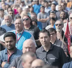  ?? CHRIS YOUNG / THE CANADIAN PRESS ?? Workers at a Bombardier plant in Toronto assemble this week to hear Unifor National president Jerry Dias speak amid calls for Boeing to drop a trade complaint against Bombardier.