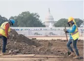  ?? J. SCOTT APPLEWHITE/AP ?? Workers repair a park last week near the Capitol as lawmakers focus on a infrastruc­ture deal.