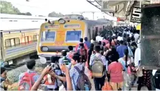  ??  ?? Koyambedu terminus was mostly empty on Thursday (left); crowd at Tambaram railway station waiting for EMU