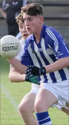  ??  ?? Joe Devlin of Good Counsel tries to escape the close attention of Harry Curtis (St. Peter’s).