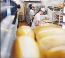  ?? LUKE SHARRETT / THE NEW YORK TIMES ?? DV8 Kitchen is a restaurant in Lexington, Ky., dedicated to helping drug addicts recover. Here, employees work in the restaurant’s bakery.