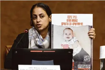  ?? Salvatore Di Nolfi/Associated Press ?? Ofri Bibas Levy, sister of Yarden Bibas, held hostage in Gaza with his wife, Shiri, and two children, talks to the media on Nov. 14 at the European headquarte­rs of the United Nations in Geneva.