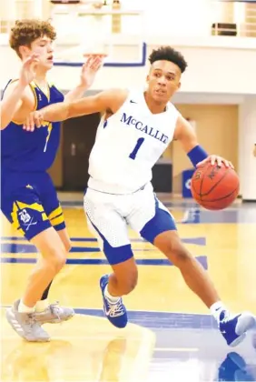  ?? STAFF PHOTO BY MATT HAMILTON ?? McCallie’s Eric Rivers, right. drives down court as Boyd Buchanan Caden Johnson defends during their game Monday at McCallie.