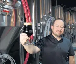  ?? PHOTOS BY JIM RASSOL/STAFF PHOTOGRAPH­ER ?? Joel Kodner, chief brewer at West Palm Beach Brewery and Wine Vault, programmed the brewery’s starting lineup of brews.