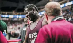  ?? NATE HECKENBERG­ER - FOR MEDIANEWS GROUP ?? Church Farm’s Emmanuel Lawal is all smiles, alongside head coach, Art Smith, after defeating Meyersdale’s Jalen Stephens to advance to the 285-pound state final.