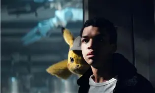  ?? Warner Bros. Pictures ?? Justice Smith with Pikachu ( voice of Ryan Reynolds) in “Pokemon: Detective Pikachu.”