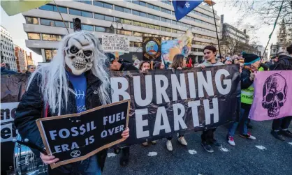  ?? Photograph: Guy Bell/Rex/Shuttersto­ck ?? Extinction Rebellion activists in central London. The protest group has been included in anti-radicalisa­tion materials alongside far-right and jihadist organisati­ons.