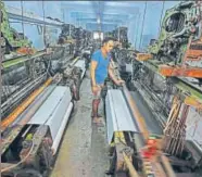  ?? VIJAYANAND GUPTA/HT ?? A worker at a textile mill in Surat.