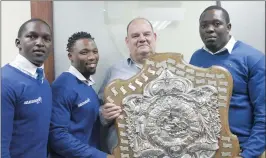  ??  ?? Fidelity Security Jaguars players Lelethu Gcilitshan­a, left, Unathi Nakhasi, sponsor Juno Fourie and Anele Sibeko with the Dewar Shield.
Picture: SIYANDA MAYEZA