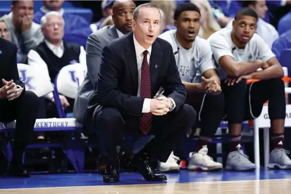  ?? Andy Lyons / Getty Images ?? Aggies coach Billy Kennedy has seen his team plummet from No. 5 in the Associated Press poll to being unranked this week.