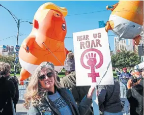  ?? KAMIL KRZACZYNSK­I AFP/GETTY IMAGES ?? A women’s rally in Chicago held to inspire voter turnout at the midterm polls.