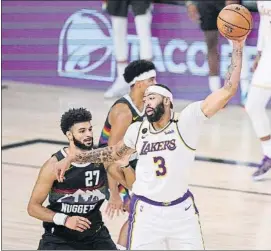  ?? FOTO: AP ?? Jamal Murray y Anthony Davis, cara y cruz del tercer partido de la final del Oeste