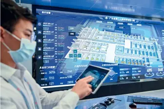  ??  ?? A medical worker at the Guangdong Second Provincial General Hospital demonstrat­es the function of the hospital’s smart system on March 1, 2021. The hospital is the first whole-scenario smart hospital in China’s mainland.