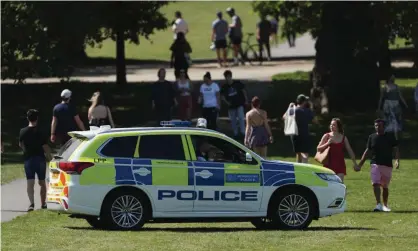  ?? Photograph: Yui Mok/PA ?? Police officers in a patrol car in Greenwich Park, London.