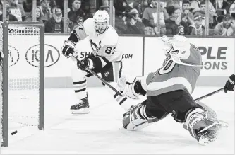  ?? TOM MIHALEK THE ASSOCIATED PRESS ?? Penguins’ Sidney Crosby scores on Flyers’ Michal Neuvirth. An 8-5 victory won the series for Pittsburgh.