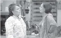  ?? ADAM ROSE/ABC VIA AP ?? Roseanne Barr, left, and Laurie Metcalf appear in a scene from the reboot of ABC’s “Roseanne.”