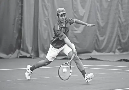  ?? THE COMMERCIAL APPEAL FILES ?? May 12, 2014: Sairan Gudiseva, a junior from White Station High School, returns the ball while playing against Germantown’s Will Spencer during a final match at the state tennis qualifying tournament at Whitehaven Tennis Center.