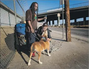  ?? Photograph­s by Gina Ferazzi Los Angeles Times ?? QUENTIN SORILLO and Dana McCarthy live on the streets, a short distance from a Sun Valley lot where a homeless housing project was stalled when Councilwom­an Nury Martinez withheld a key letter.