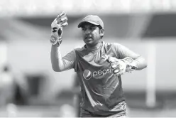  ?? Associated Press ?? Pakistan's captain Sarfraz Ahmed trains Saturday at the Oval cricket ground in London. India are due to play Pakistan in the ICC Trophy final cricket match at the Oval on Sunday.