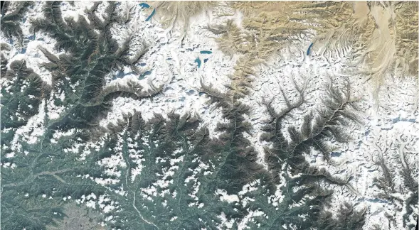  ?? AFP ?? A satellite image shows the city of Kathmandu, Nepal, bottom left, in a valley south of the Himalayan mountains between Nepal and China. Glaciers, and the lakes formed by glacial meltwater, are visible in the top middle of the image.