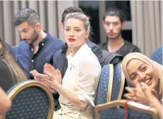  ??  ?? US actress Amber Heard looks on after meeting with Syrian refugees in Amman, Jordan.