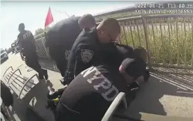  ?? New York Police Department ?? An image from body camera footage shows police officers arresting a man on a boardwalk at Rockaway Beach in the Queens borough of New York City.