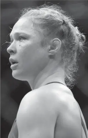  ?? ASSOCIATED PRESS FILE PHOTO ?? Ronda Rousey stands in the cage after Amanda Nunes forced a stoppage in the first round last December. Rousey, once a UFC star, has faded from the spotlight.