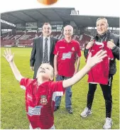  ??  ?? Six-year-old Harvey Jones with grandad Llion on the Racecourse pitch with Joey Jones and Richard Hughes, left, from Ifor Williams Trailers
