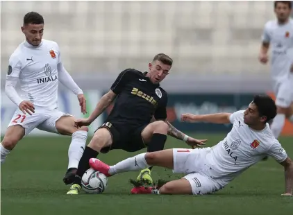  ??  ?? Hibernians's goalscorer Jurgen Degabriele (C) is challenged by Valletta's Shaun Dimech (R) and Eslit Sala (R). Shaun Dimech was sent off for this tackle. Photos © Domenic Aquilina