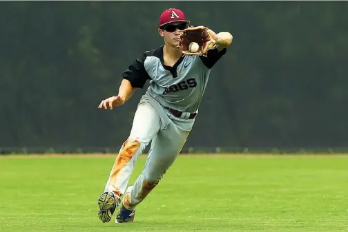  ?? Photos by Justin Manning/Special to the Gazette ?? top Texarkana Razorbacks’ Black Hall makes a catch in the bottom of the seventh inning against the Bryant Black Sox on Sunday in Conway, Ark.