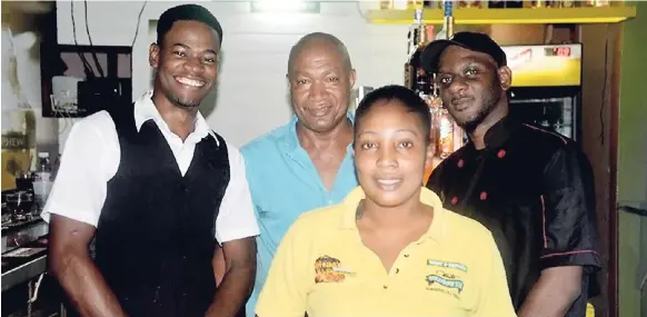  ?? PHOTOS BY OKOYE HENRY ?? MoBay Proper staff. From left: Doiley Murray, bartender; Calvin Malcolm, owner; Garcia Leslie, waitress; and Eurol Maxwell, chef.