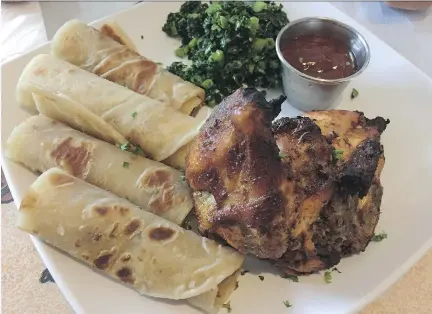  ?? PHOTOS: PETER HUM ?? Barbecue chicken with chapati (unleavened flatbread) at Jambo Restaurant.