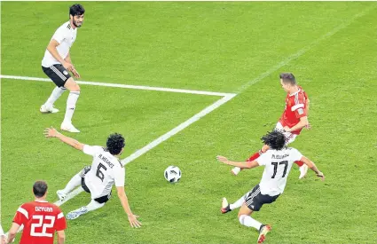  ?? EPA ?? Russia’s Denis Cheryshev, right, scores his team’s second goal
— his third of the tournament — against Egypt at the Krestovsky Stadium in St Petersburg.