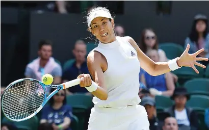  ?? Picture: AFP ?? NO SWEAT. Spain’s Garbine Muguruza (above) beat Britain’s Naomi Broady in straight sets to reach the second round at Wimbledon yesterday.