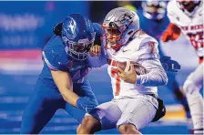  ?? STEVE CONNER/ASSOCIATED PRESS ?? UNM quarterbac­k Bryson Carroll (7), shown in action Saturday at Boise State, began the season as a student manager.