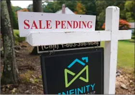  ?? (AP) ?? A pending-sale sign is displayed outside a home in East Derry, N.H., in this file photo.