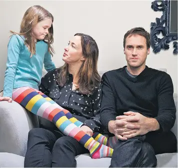  ??  ?? Harmonious: Jancee Dunn and her husband Tom with daughter Sylvie
