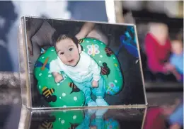  ??  ?? LEFT: District Attorney Raúl Torrez keeps a photo in his office of a little boy, Marcelino Aragon, a victim in a shaken baby case that was Torrez’s first trial.