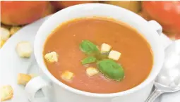  ?? DREAMSTIME ?? Eggplant adds creaminess and texture to this smoky tomato soup.