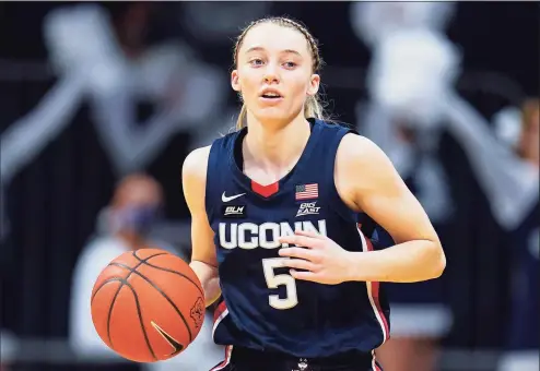  ?? Michael Conroy / Associated Press ?? UConn’s Paige Bueckers plays against Butler during the first quarter of a game in Indianapol­is on Feb. 27.