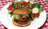  ?? TRIBUNE NEWS SERVICE LINDA GASSENHEIM­ER / ?? Wild mushroom and beef burgers.