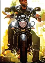  ??  ?? REVVED UP: Ore Oduba makes his dramatic entrance aboard a motorbike
