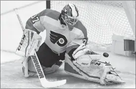  ?? AP PHOTO ?? Flyers goaltender Brian Elliott blocks a shot during the first period in Friday’s NHL playoff game against the Penguins at Pittsburgh. Elliott made 34 saves.