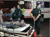  ?? PICTURES: XINHUA ?? Medical workers transport a person injured in an explosion outside a kindergart­en into a hospital in Fengxian County in eastern China’s Jiangsu Province on Thursday.