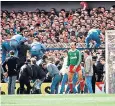  ??  ?? Liverpool goalkeeper Bruce Grobbelaar is unaware of events unfolding behind him