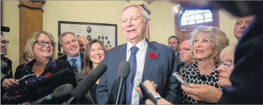  ?? CP PHOTO ?? New Brunswick Progressiv­e Conservati­ve Leader Blaine Higgs answers questions from the media after defeating the Liberal Government at the New Brunswick Legislatur­e in Fredericto­n on Friday.