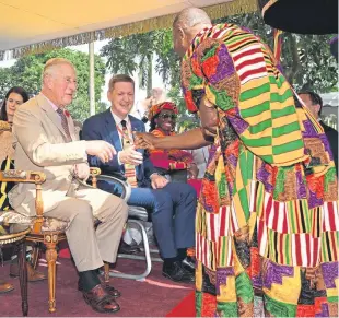  ?? Picture: Tim Rooke. ?? Prince Charles sits with Ian Walker as he visits the Manhyia Palace.