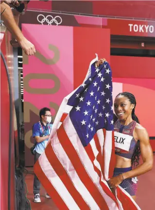  ?? Patrick Smith / Getty Images ?? Bronze medalist Allyson Felix celebrates after competing in the women’s 400 meters on Friday at Olympic Stadium in Tokyo. It was her 10th Olympic medal.