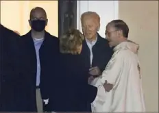  ?? Patrick Semansky/Associated Press ?? President Joe Biden, center, speaks with his sister, Valerie Biden Owens, and a priest after attending Mass on Saturday at St. Joseph on the Brandywine Catholic Church in Wilmington, Del.